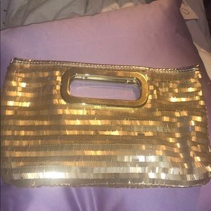 Gold small handbag.